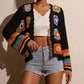 Retro-tyylinen, aukko-koristeltu pitkähihainen virkkauspaita