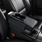 Auton käsinojan säilytyslaatikko, jossa on mukinpidin